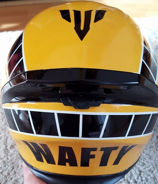 Airbrushed Painting of a Yellow Custom Helmet close up of back of the design